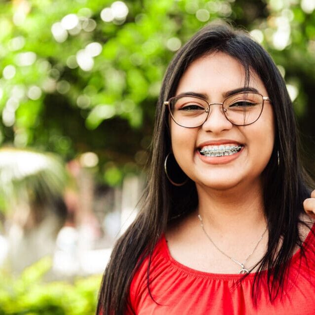 Young hispanic woman smiling wearing goggles outdoor with copy space Young hispanic woman smiling wearing goggles outdoor with copy space